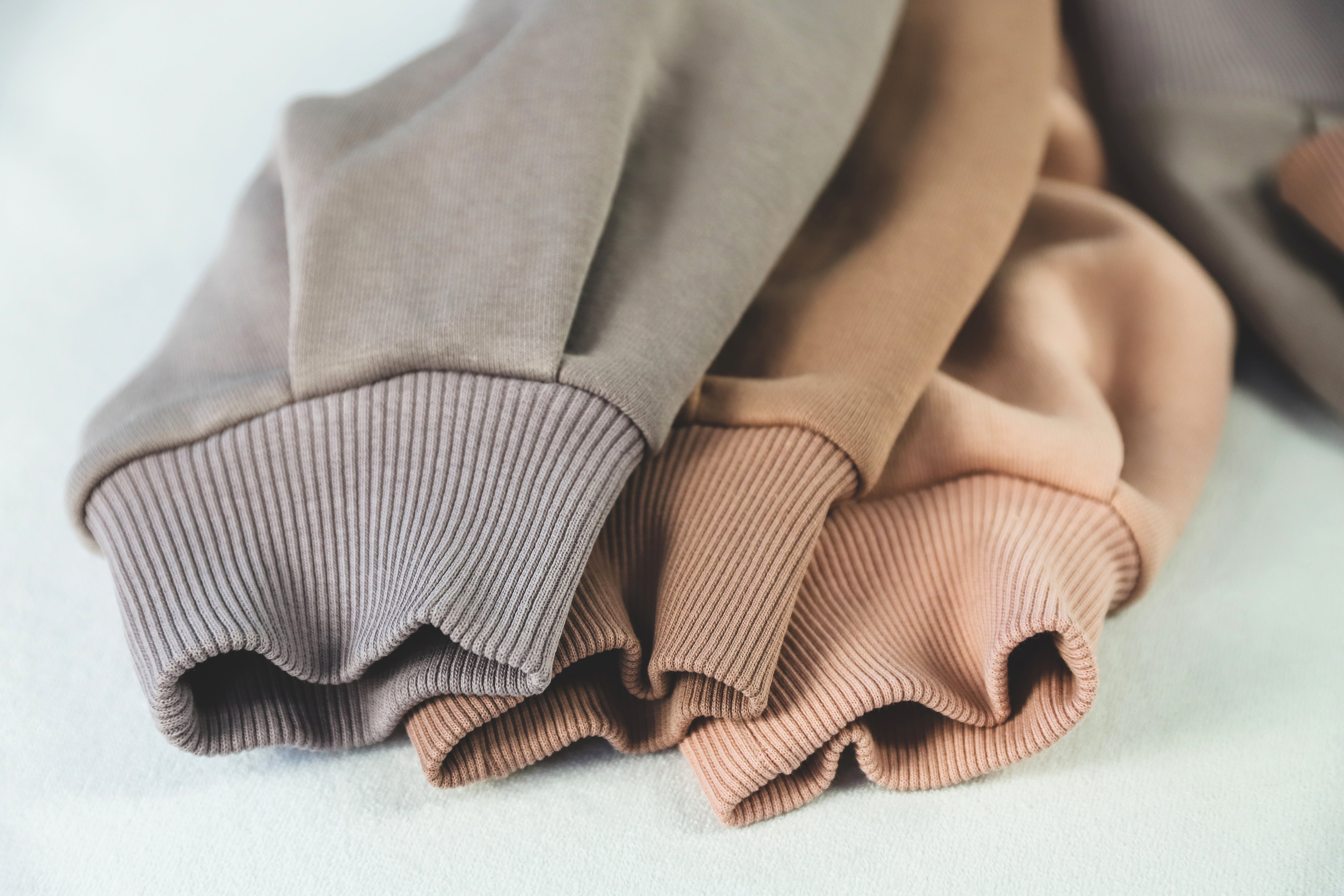 Premium fabrics for clothing production including cotton, French terry, fleece, and sustainable materials in Portugal