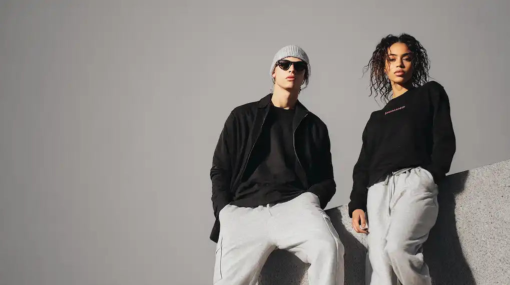 Two individuals in stylish athletic wear